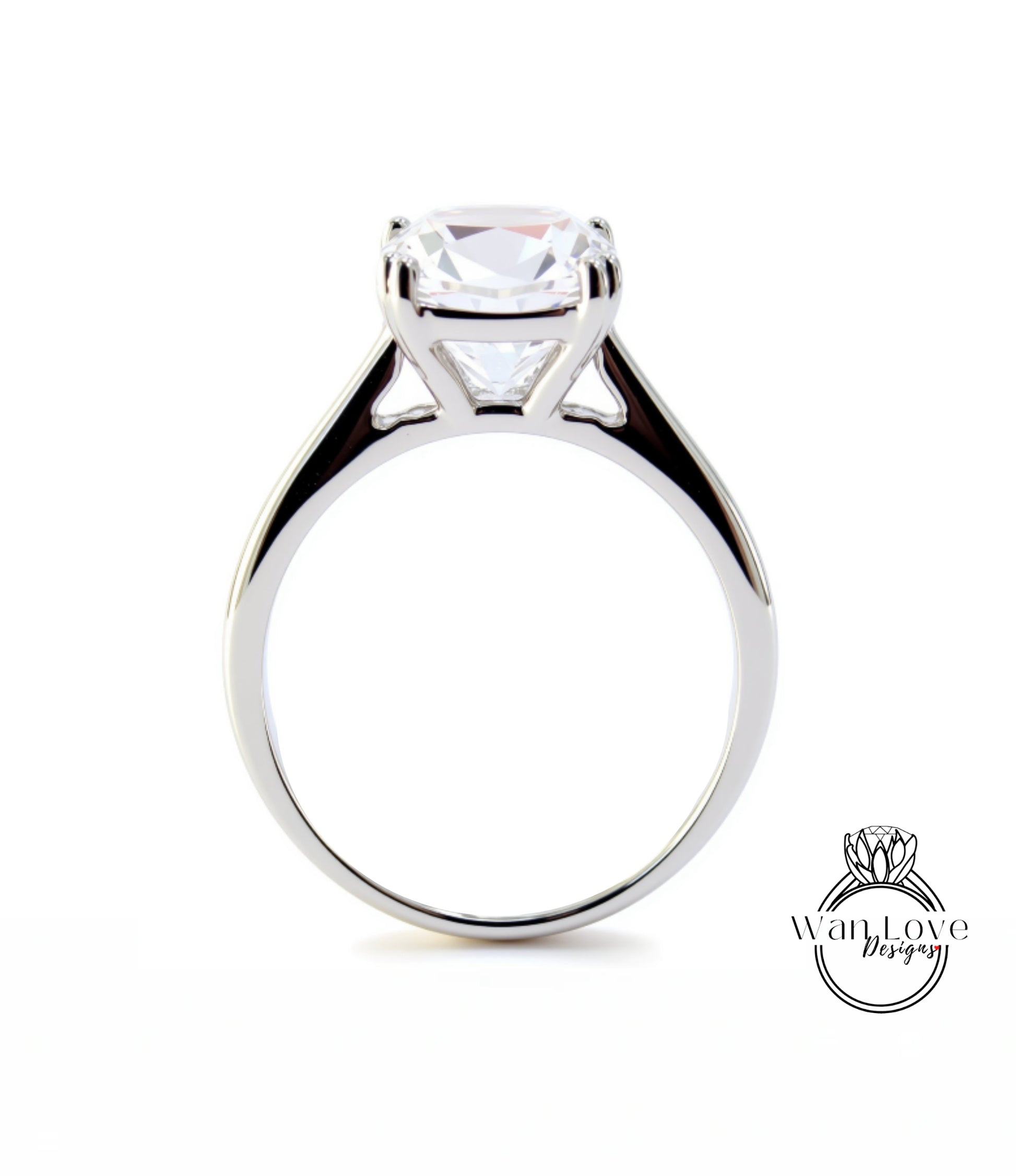 A silver engagement ring with a large, clear gemstone set in the center of the band.
