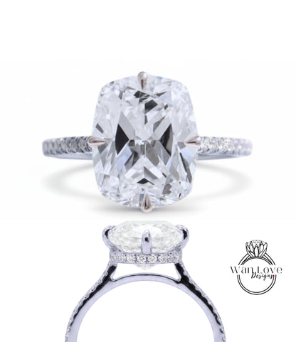 A large, clear diamond engagement ring with a halo of smaller diamonds around the center stone.