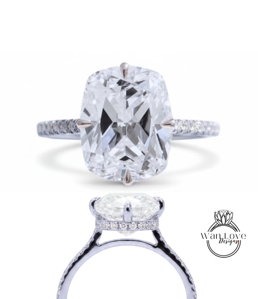 A large, clear diamond engagement ring with a halo of smaller diamonds around the center stone.