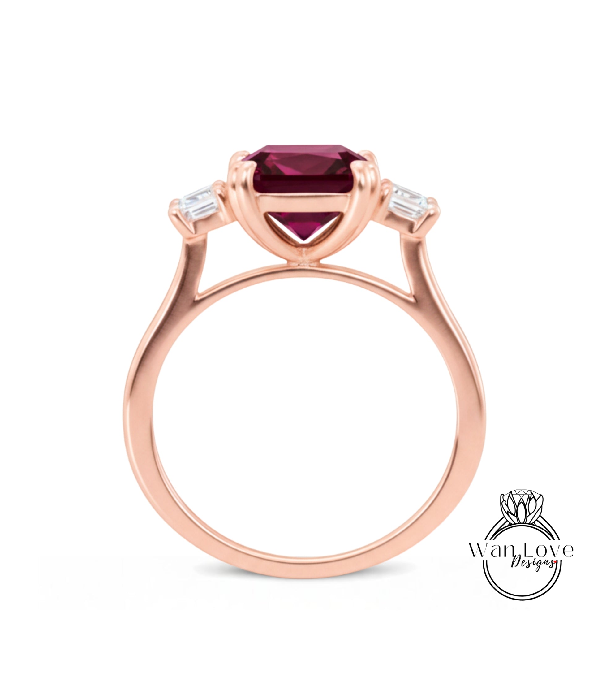 A rose gold ring with a large, deep red gemstone set in the center, surrounded by smaller diamonds.