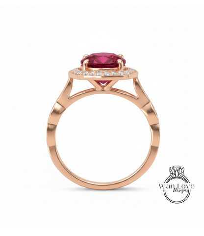 A gold ring with a large red gemstone, possibly a ruby, set in the center.