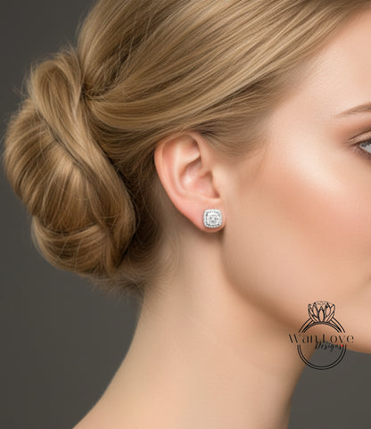 A close-up of a woman's face, focusing on her earrings and hair.