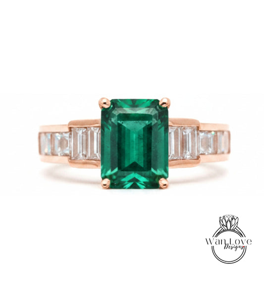 a beautiful engagement ring with a large, vibrant green gemstone set in a gold band.