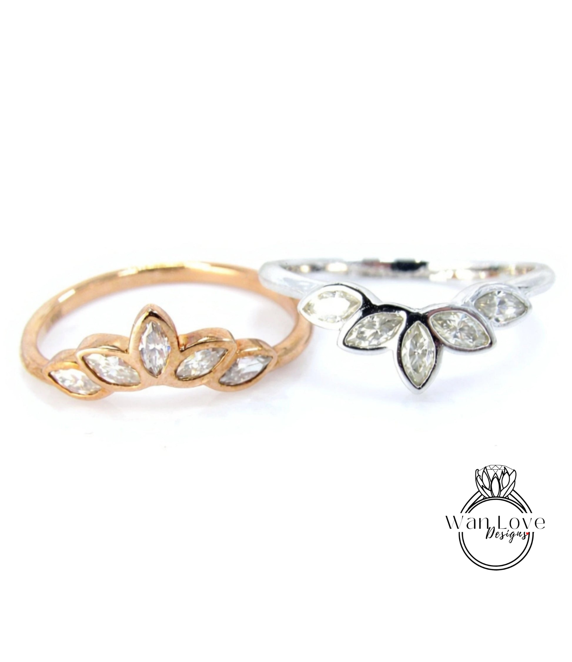 Two rings with different designs, one with a floral pattern and the other with a leaf-like pattern, both featuring small diamonds.