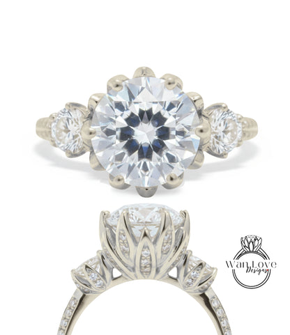 A close-up view of a diamond engagement ring with a large, round brilliant cut diamond set in a silver band with three smaller diamonds on either side.