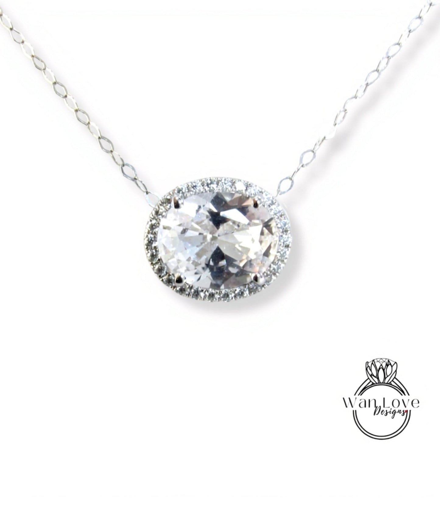 A necklace with a large, round, clear gemstone at the center, surrounded by a halo of smaller diamonds.