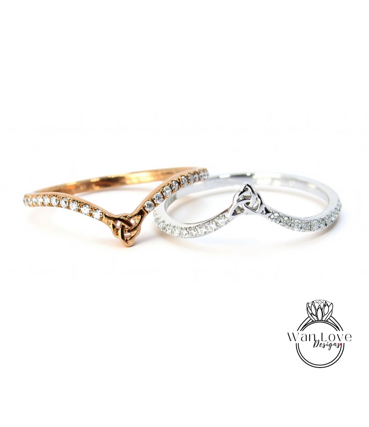 Two rings with diamonds on them are placed side by side against a white background.