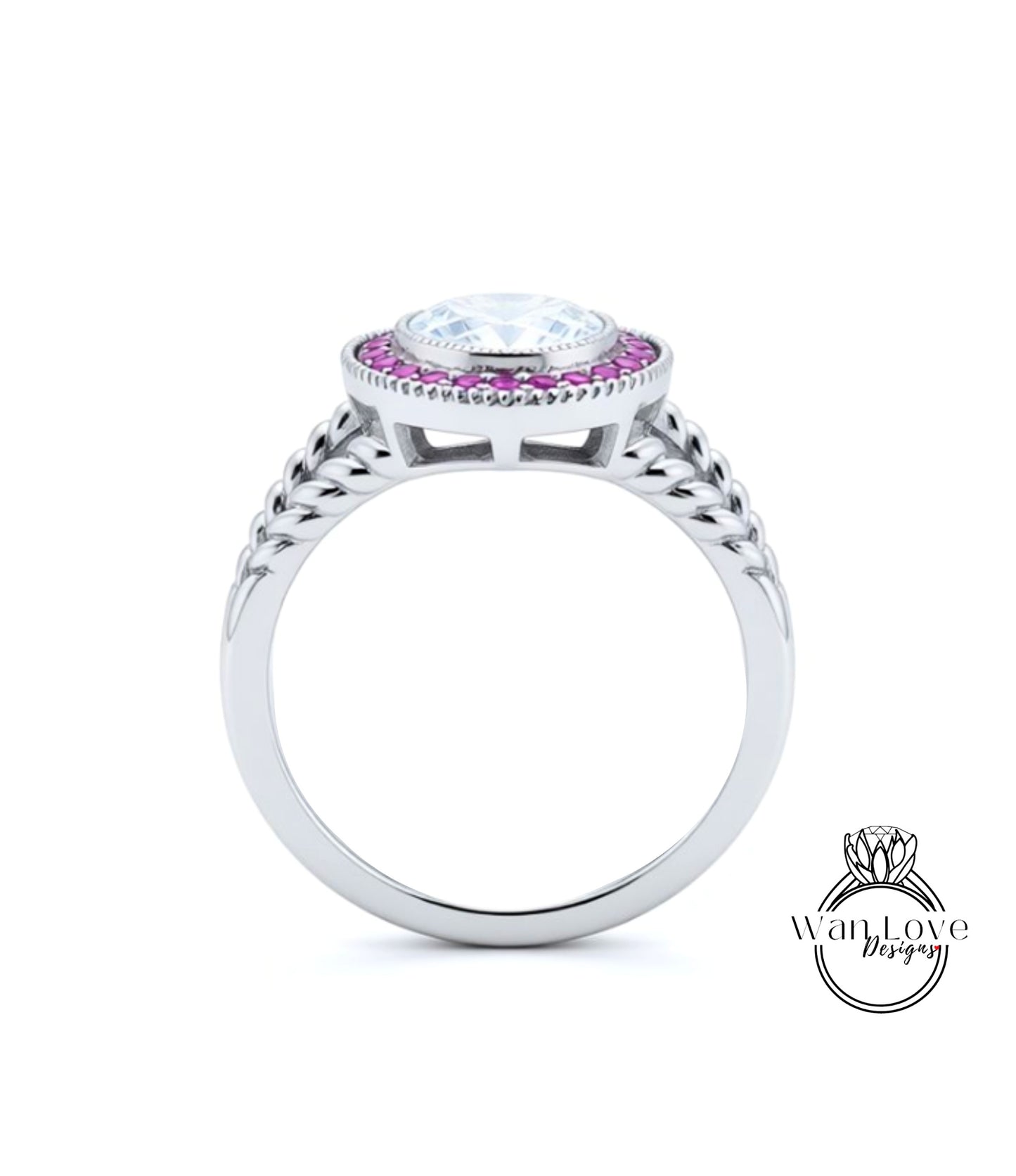 A silver ring with a large central gemstone surrounded by smaller stones, and a decorative band with braided elements.