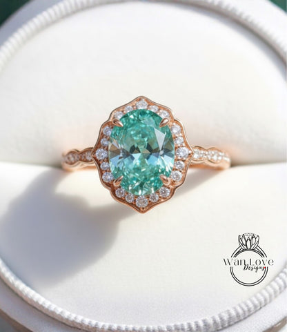 A close-up image of a beautiful engagement ring with a large oval-shaped gemstone surrounded by a halo of smaller diamonds set in a rose gold band.