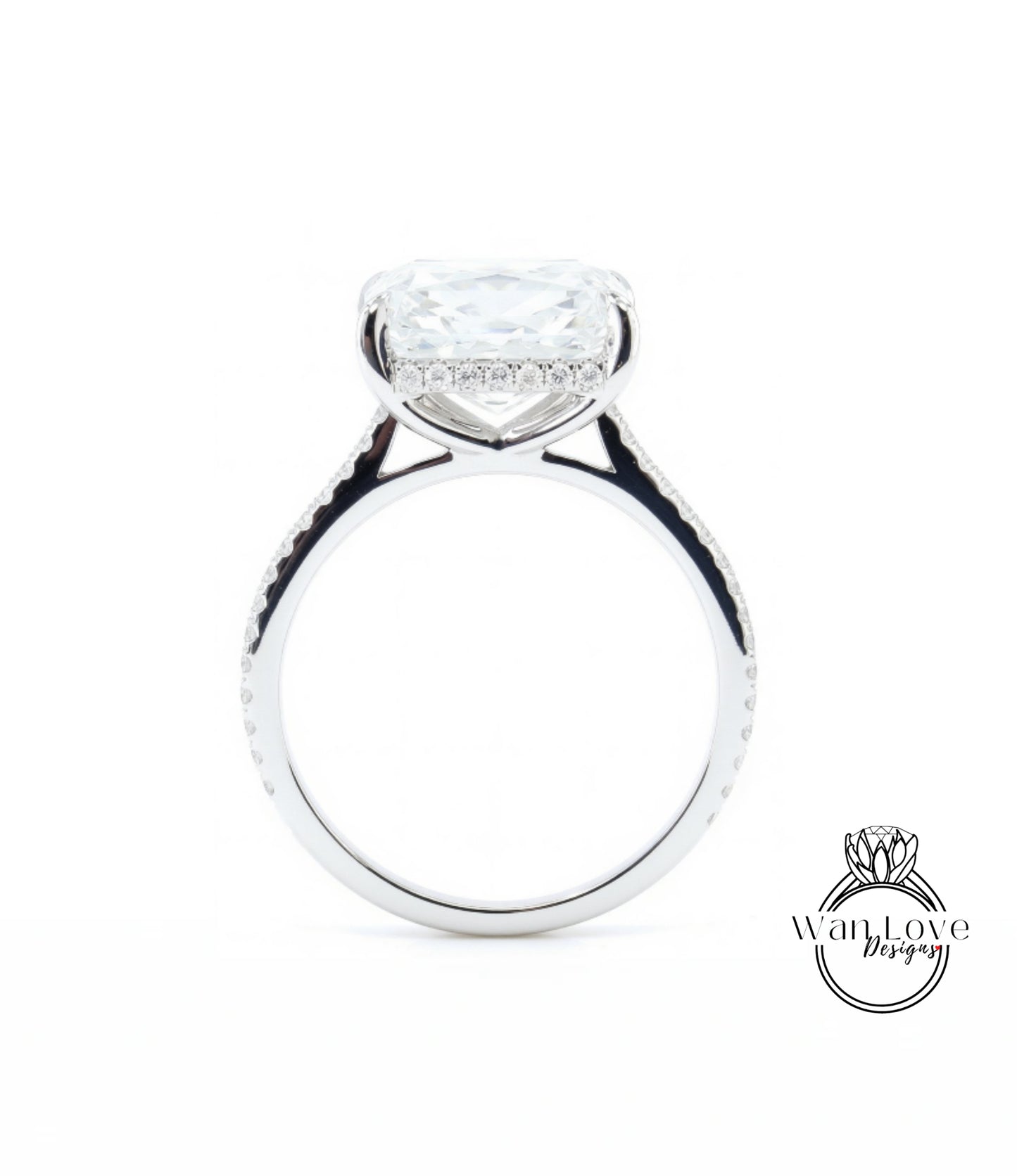 A large, clear diamond engagement ring with a halo of smaller diamonds around the center stone.