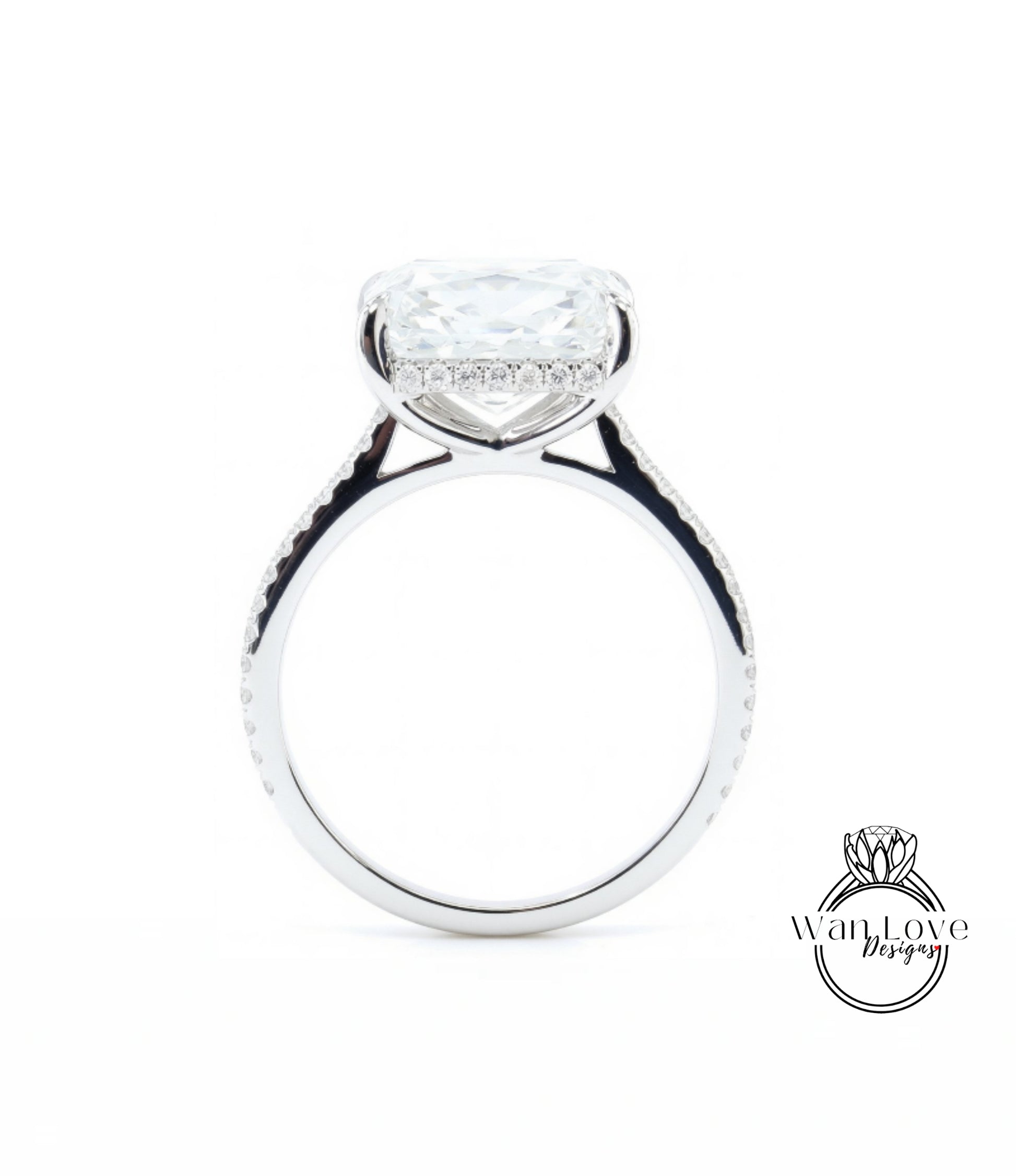 A large, clear diamond engagement ring with a halo of smaller diamonds around the center stone.