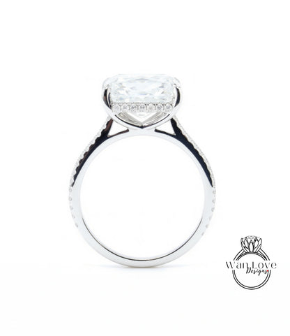 A large, clear diamond engagement ring with a halo of smaller diamonds around the center stone.