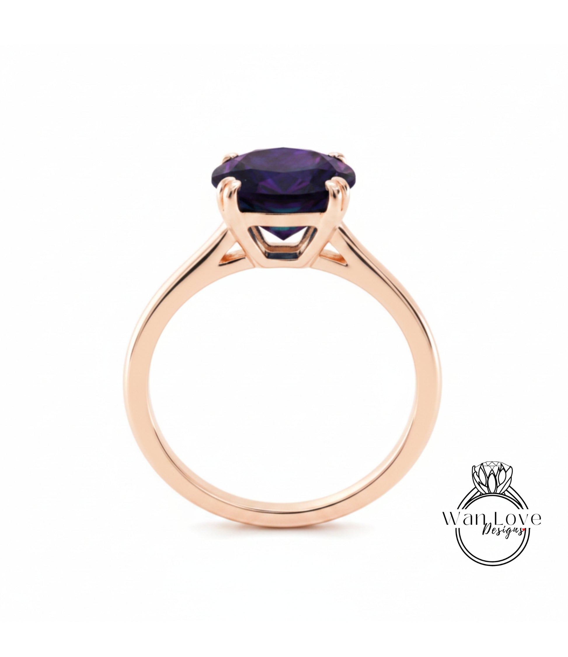 A gold ring with a large purple gemstone set in the center.