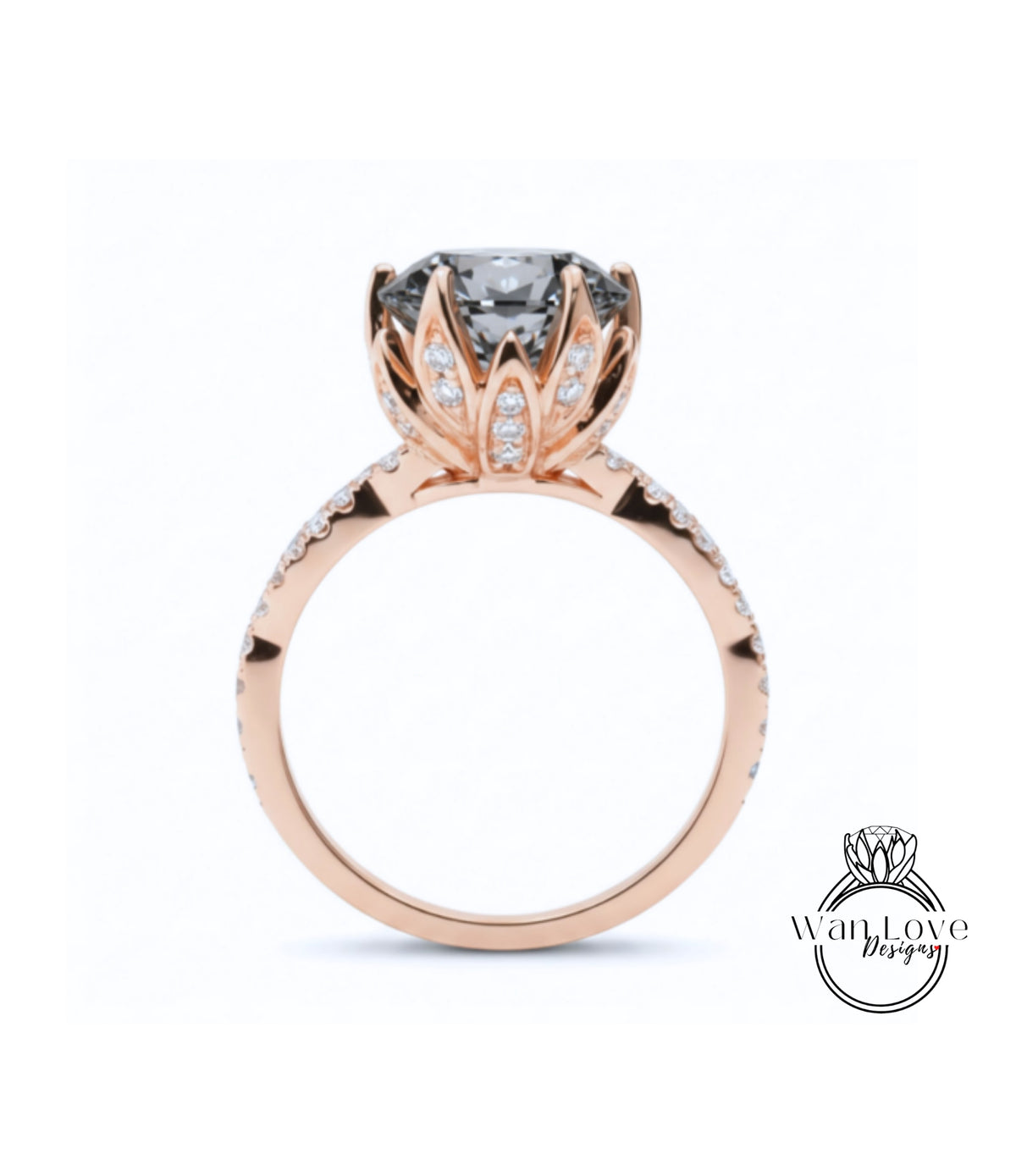 A rose gold engagement ring with a large, dark gray gemstone set in a decorative flower-like design.