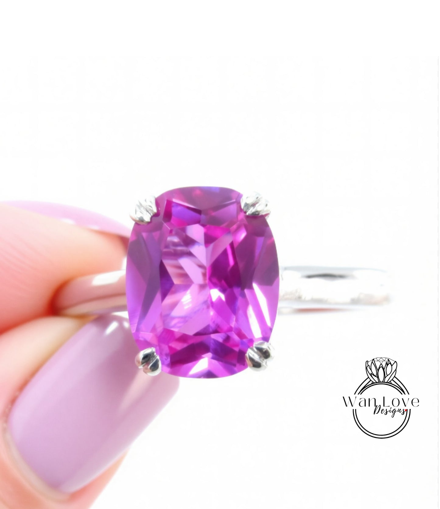 A hand holding a ring with a large, vibrant purple gemstone.