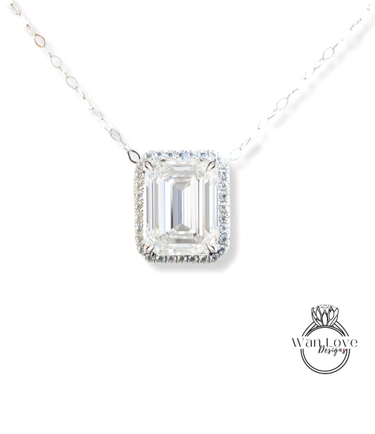 A necklace with a large, clear gemstone pendant, likely a diamond, set in a halo of smaller diamonds.