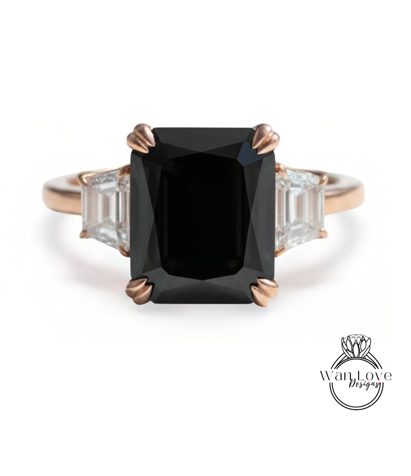A gold ring with a large black diamond as the centerpiece, surrounded by smaller diamonds.