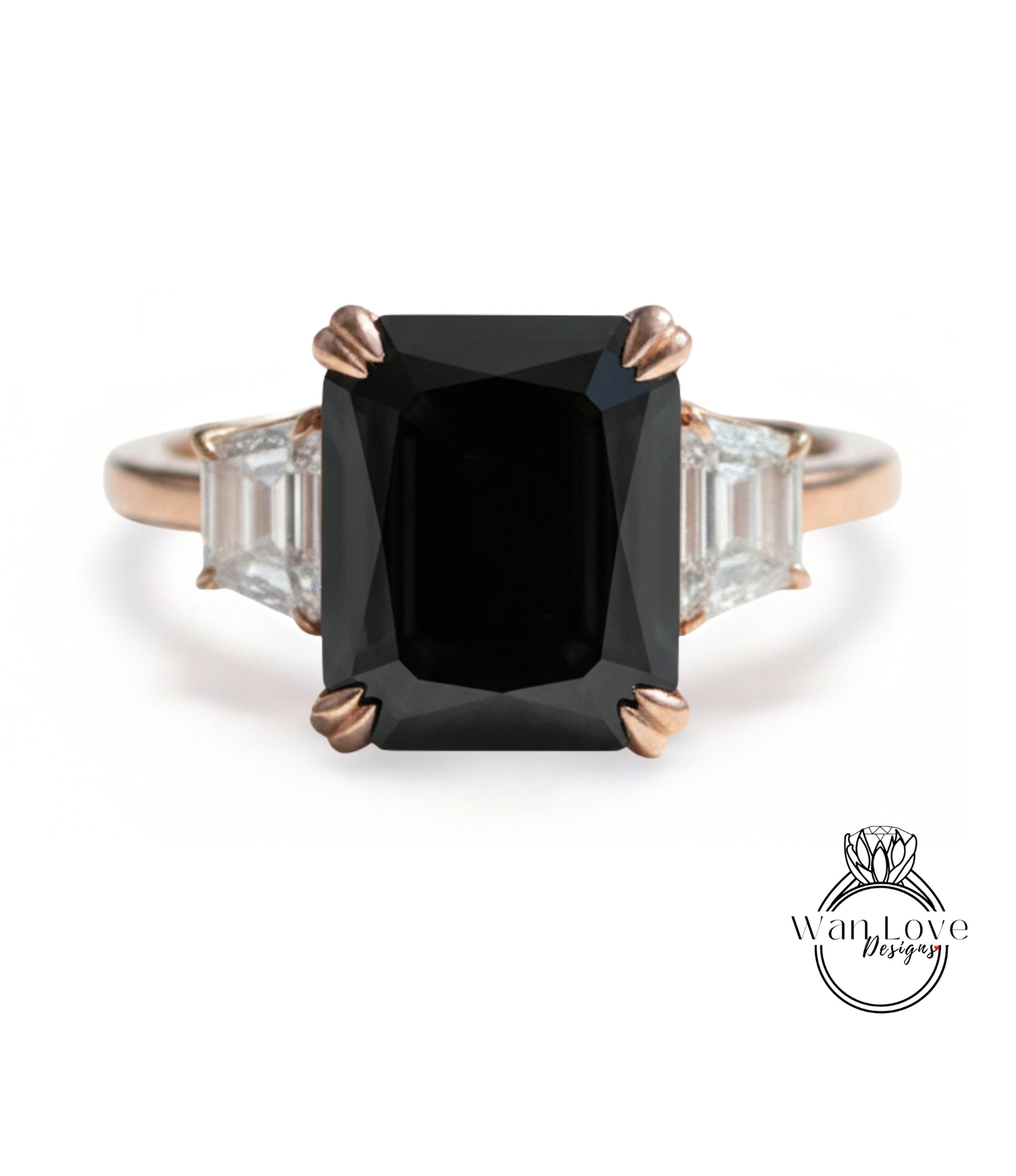 A gold ring with a large black diamond as the centerpiece, surrounded by smaller diamonds.