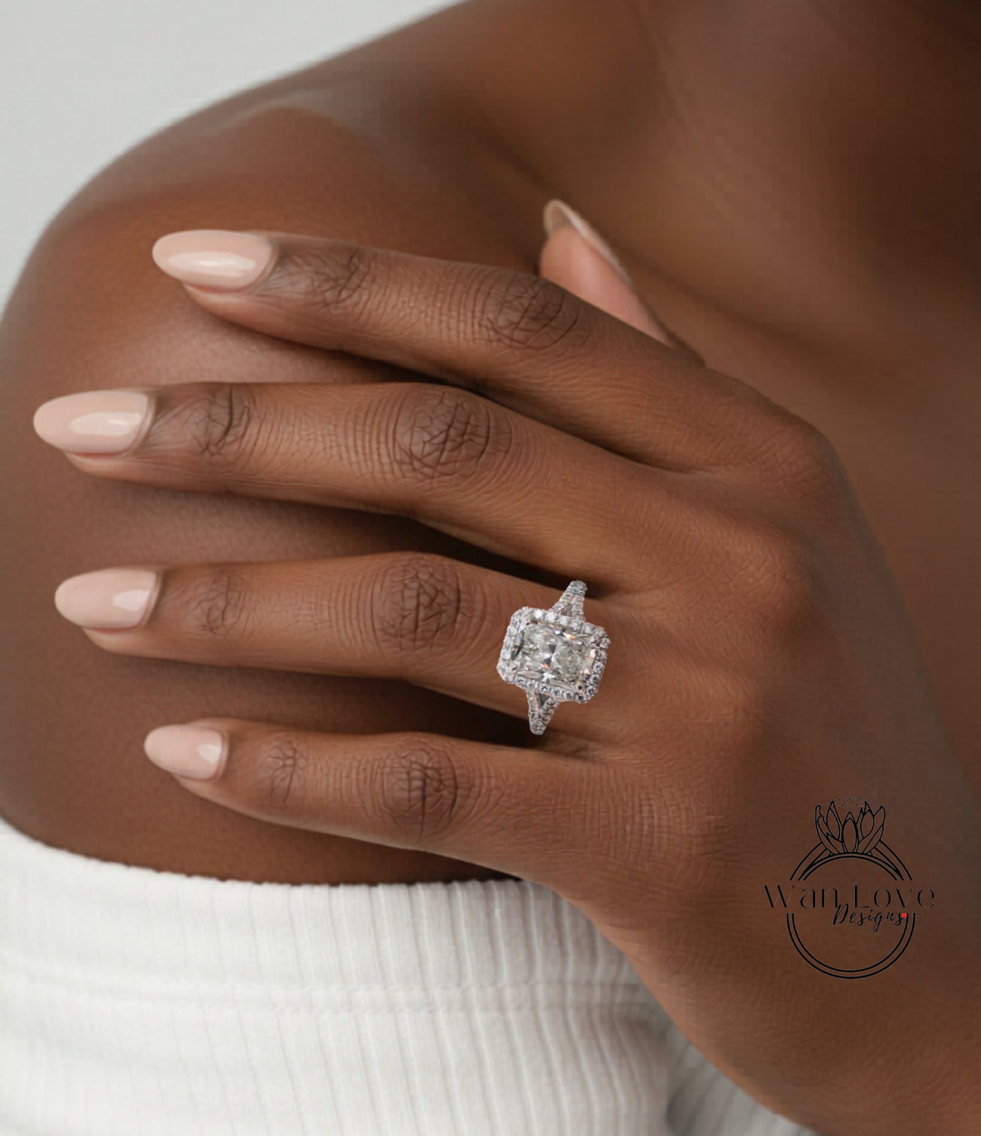 A close-up of a person's hand wearing a large, sparkling diamond engagement ring.
