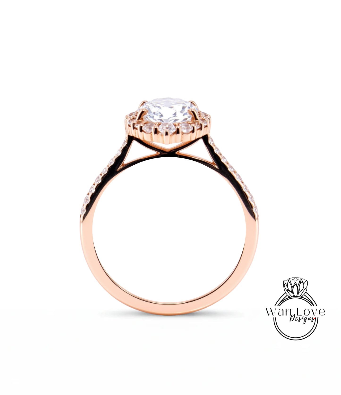 A rose gold engagement ring with a large central diamond and smaller diamonds around the halo.