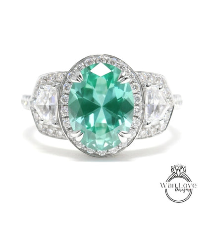A stunning engagement ring with a large oval-shaped gemstone surrounded by smaller diamonds, set in a silver band.