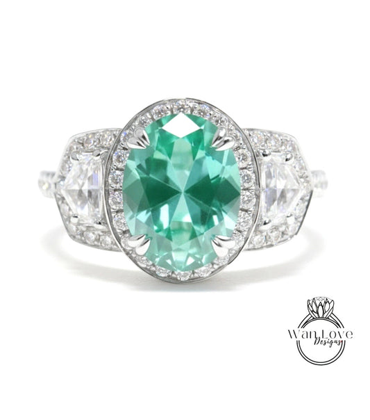 A stunning engagement ring with a large oval-shaped gemstone surrounded by smaller diamonds, set in a silver band.