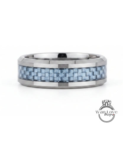 A silver ring with a blue carbon fiber band, showcasing a unique and modern design.
