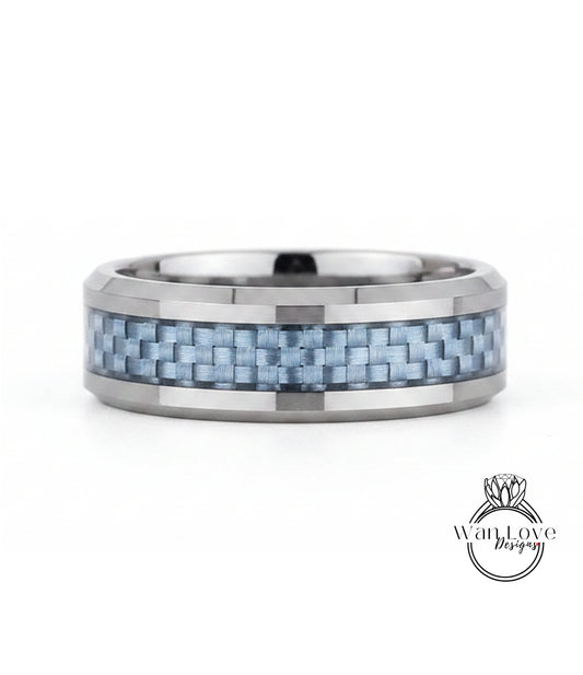 A silver ring with a blue carbon fiber band, showcasing a unique and modern design.