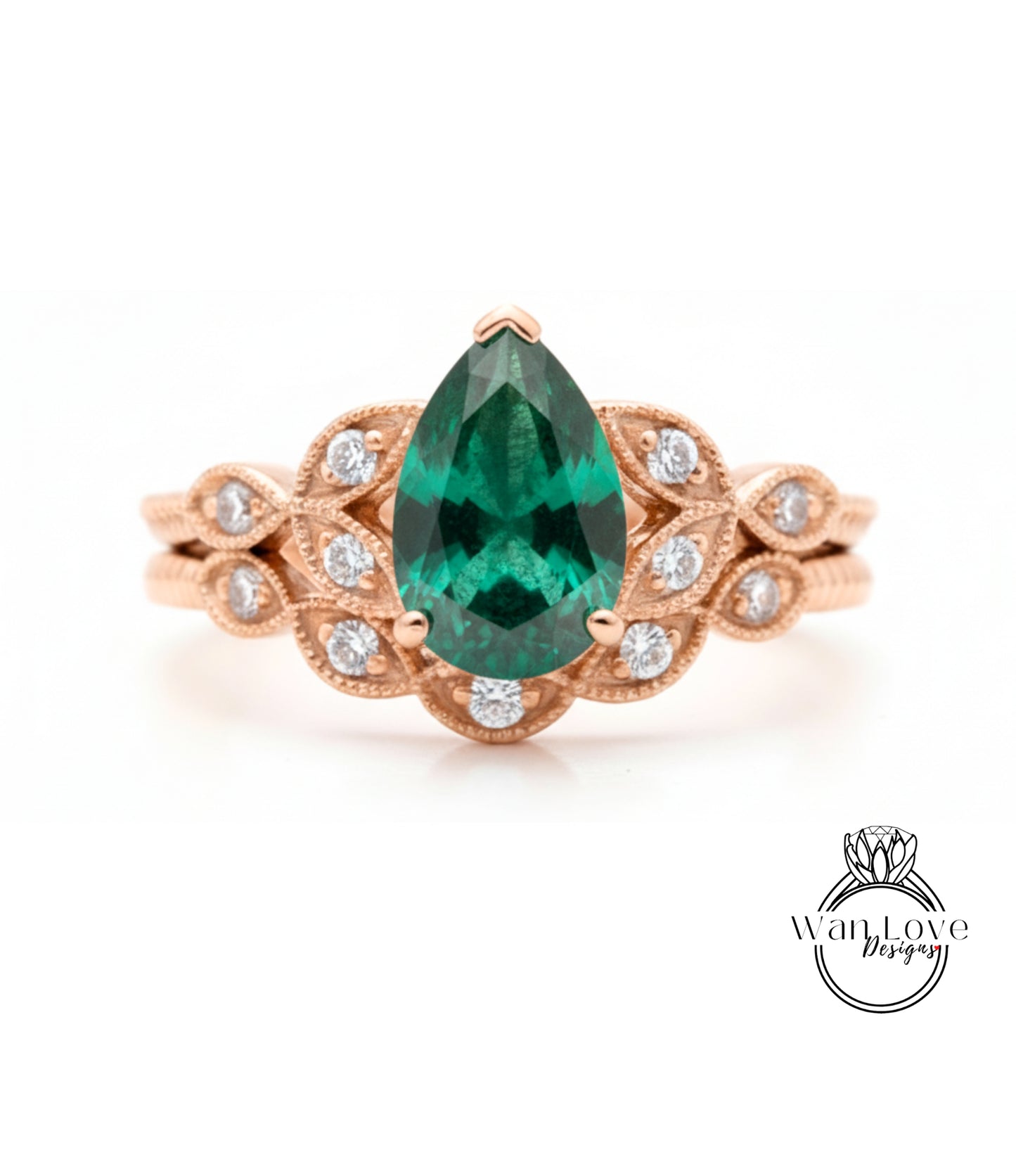 a beautiful engagement ring with a large, vibrant green gemstone set in an ornate gold band.