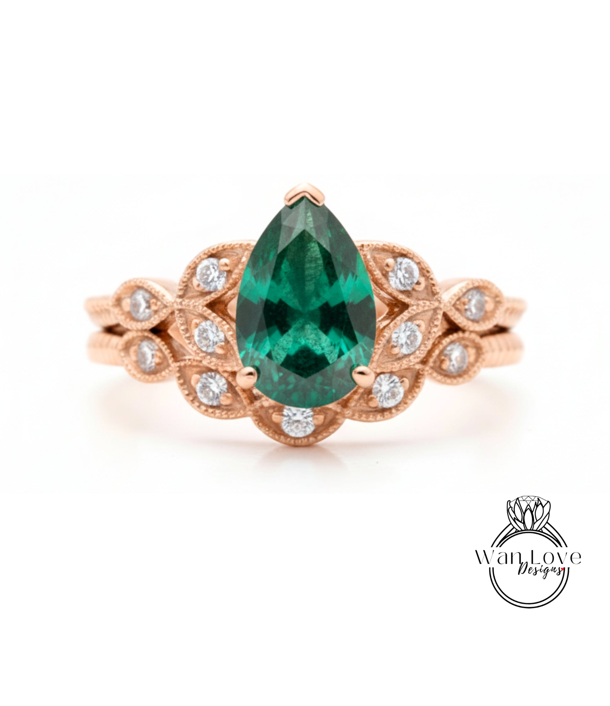 a beautiful engagement ring with a large, vibrant green gemstone set in an ornate gold band.