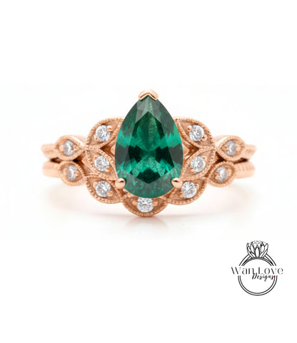 a beautiful engagement ring with a large, vibrant green gemstone set in an ornate gold band.