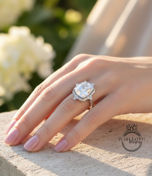 A close-up of a person's hand wearing a large diamond engagement ring.