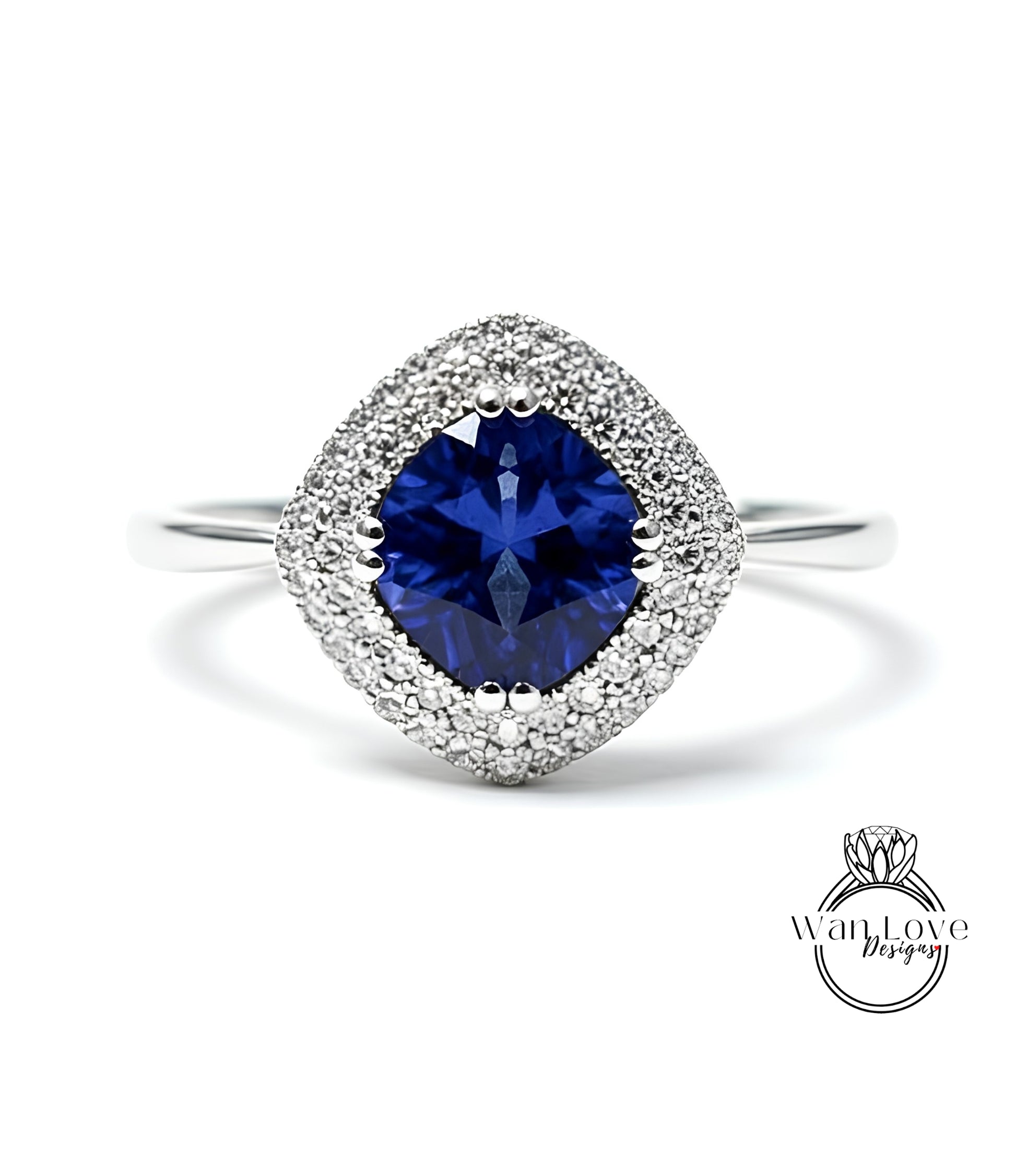 A stunning blue sapphire ring with a halo of sparkling diamonds set in a silver band.