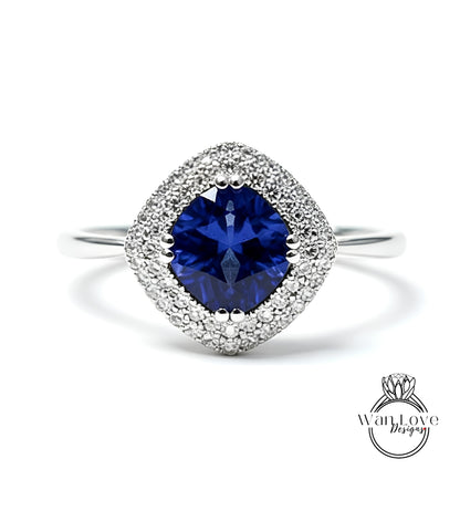 A stunning blue sapphire ring with a halo of sparkling diamonds set in a silver band.