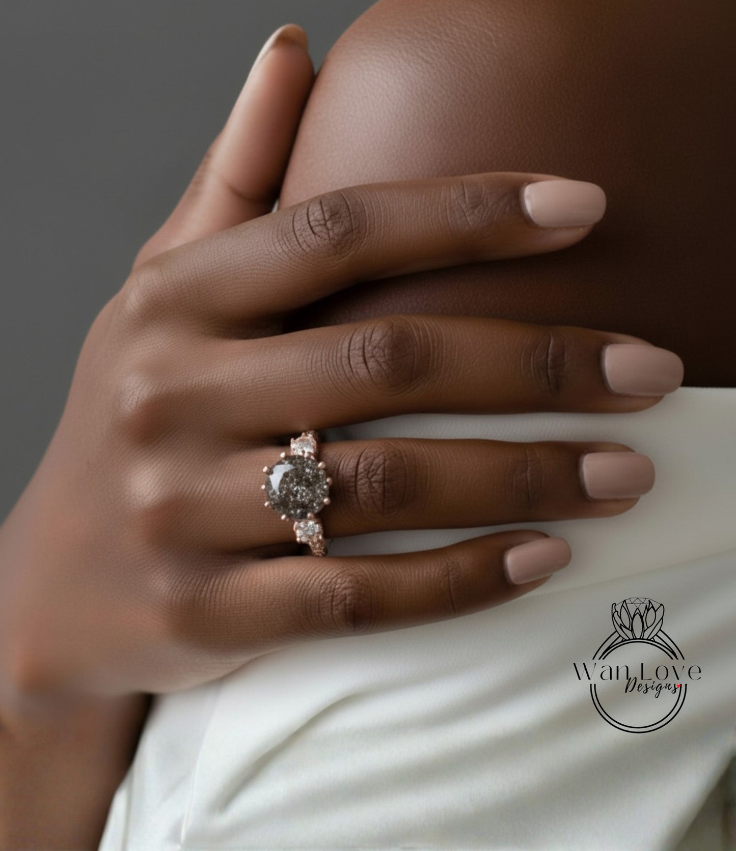 A close-up of a person's hand wearing a gold ring with a large central stone.