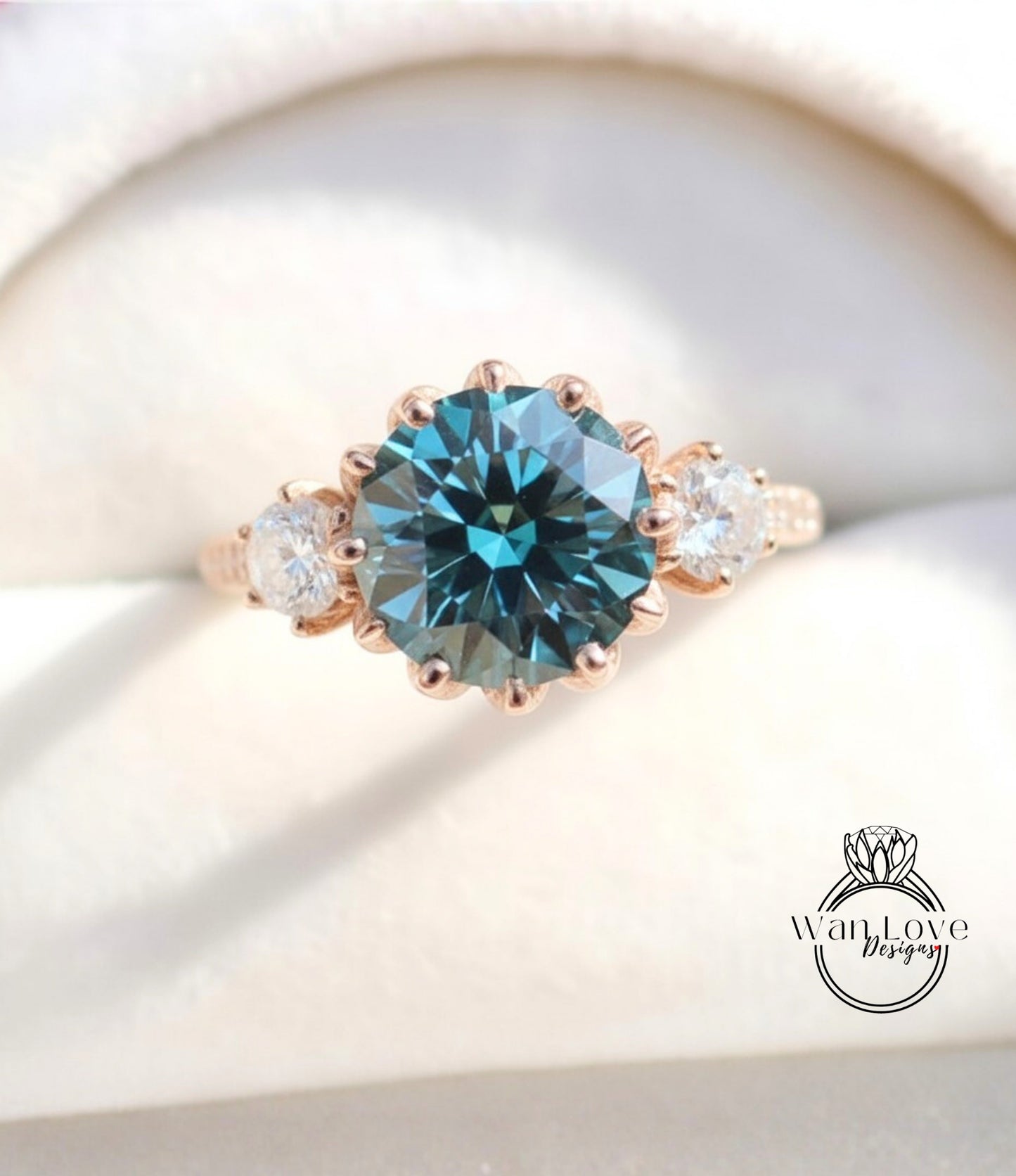 A close-up image of a gold ring with a large blue gemstone, showcasing the intricate details and craftsmanship of the jewelry.