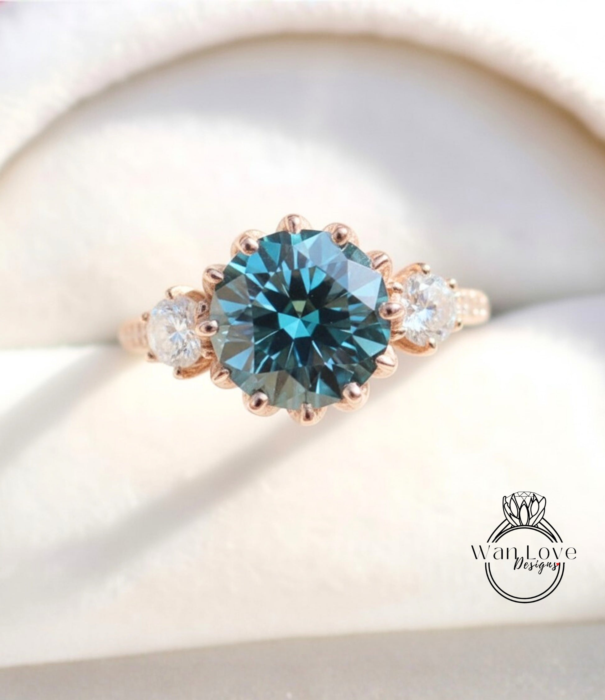 A close-up image of a gold ring with a large blue gemstone, showcasing the intricate details and craftsmanship of the jewelry.