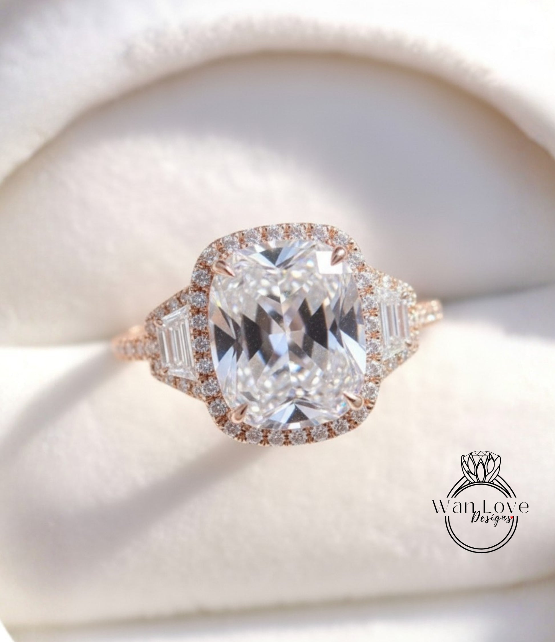 A close-up image of a beautiful diamond engagement ring with a large central diamond surrounded by smaller diamonds and a halo of smaller diamonds around the center.
