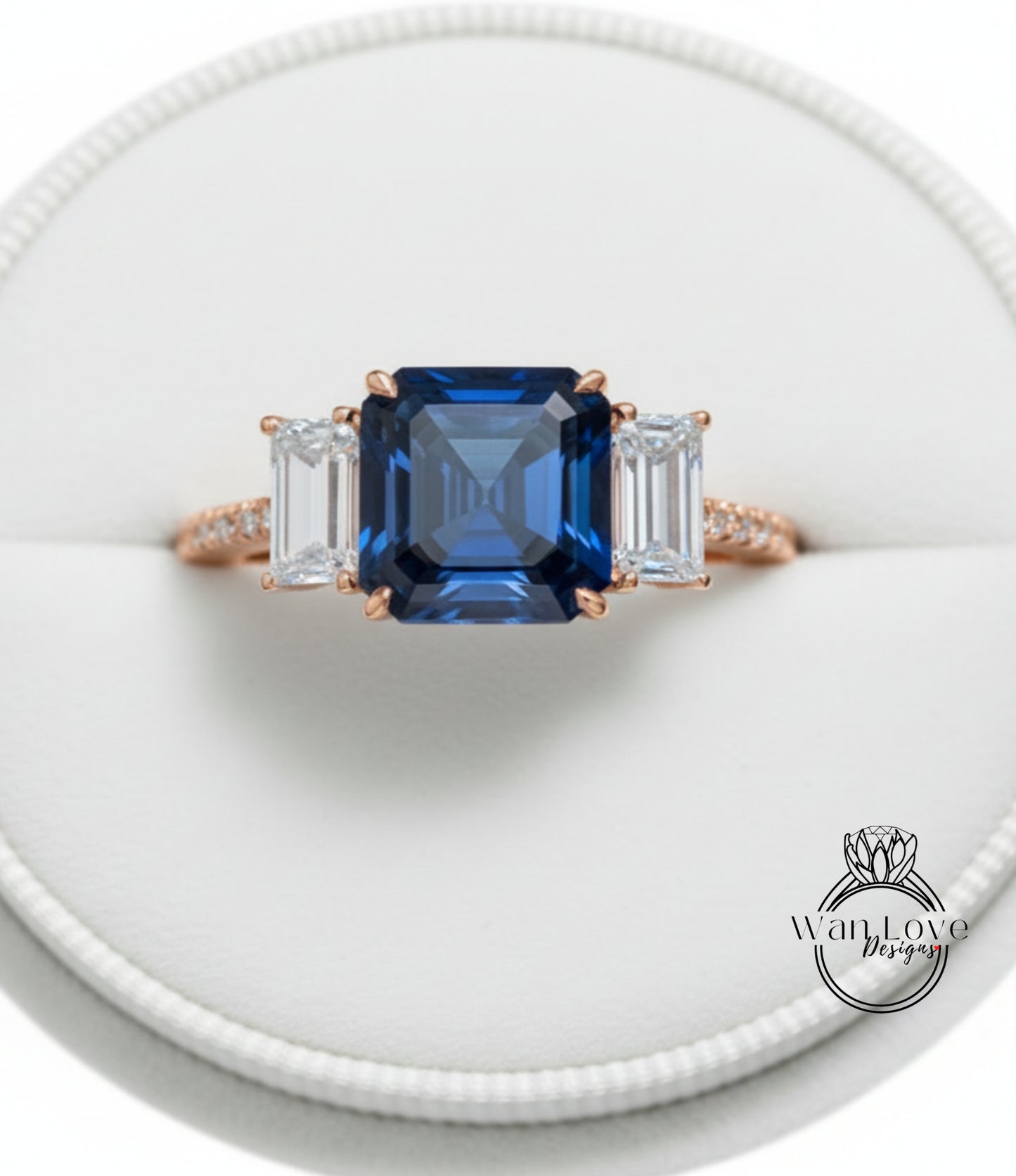 A close-up image of a gold ring with a large blue gemstone in the center, surrounded by smaller diamonds.