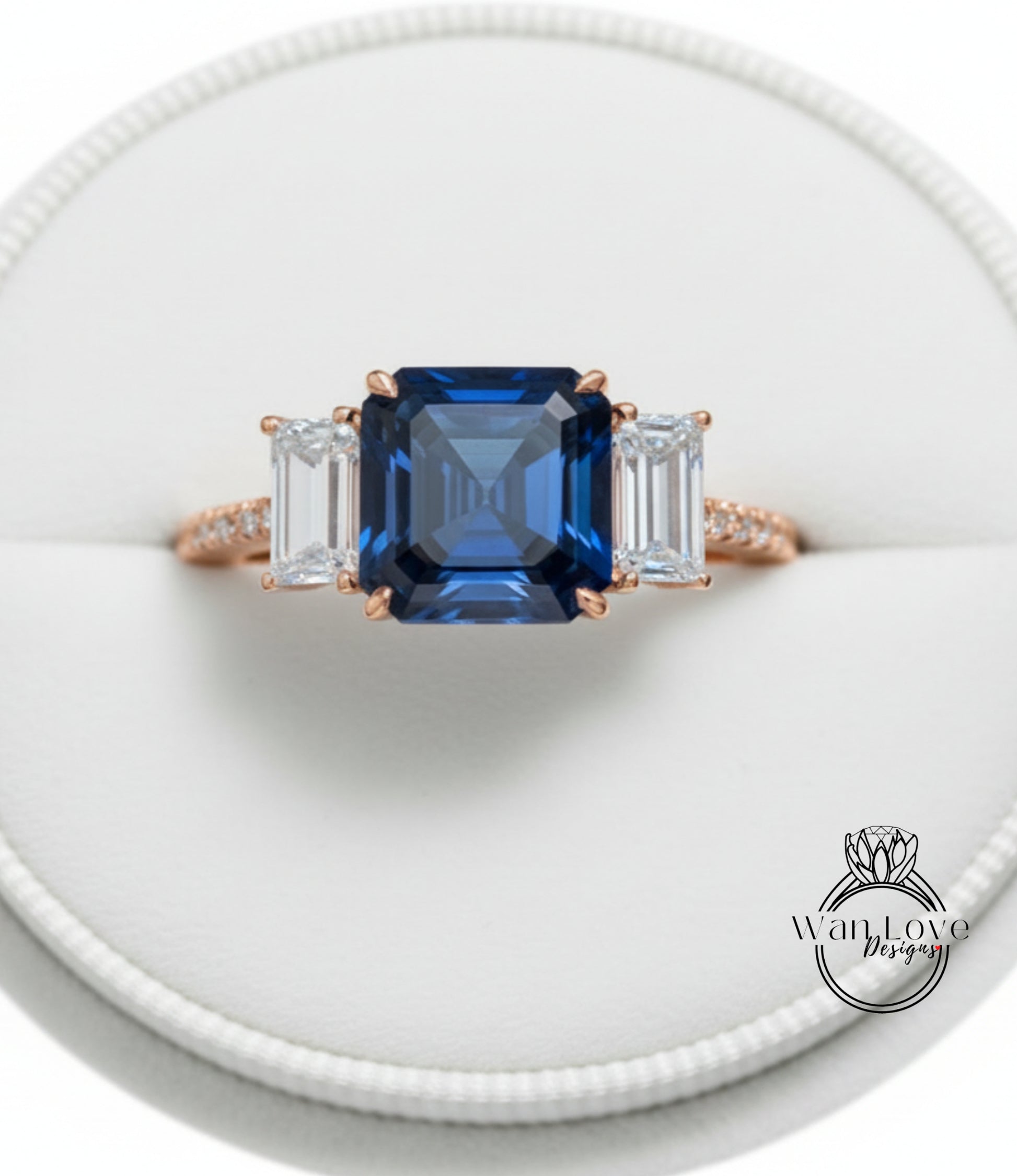 A close-up image of a gold ring with a large blue gemstone in the center, surrounded by smaller diamonds.