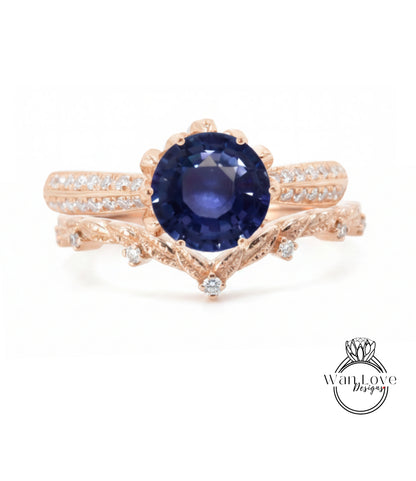 A rose gold ring with a large blue gemstone at the center, surrounded by smaller diamonds.
