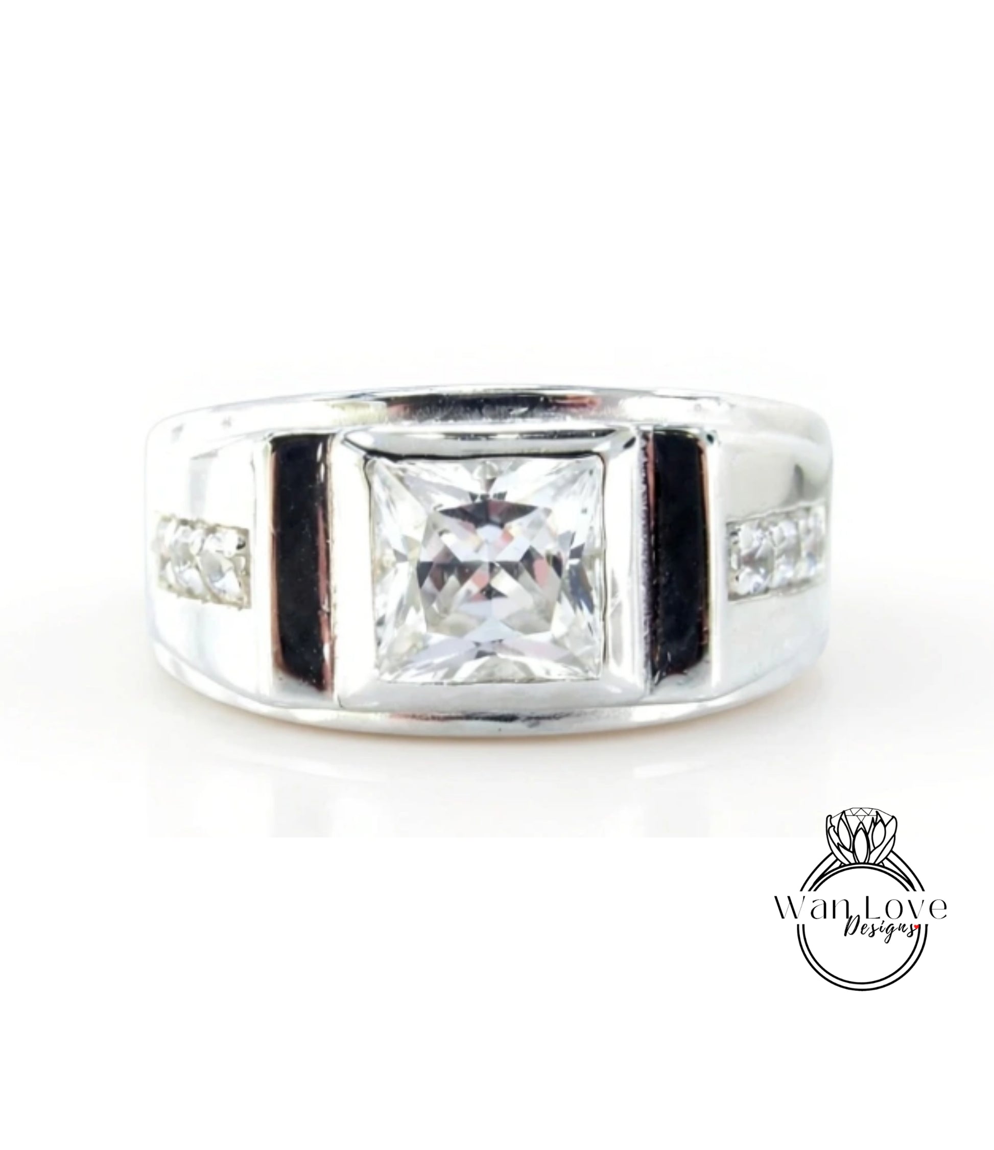 A silver ring with a large, clear gemstone in the center.