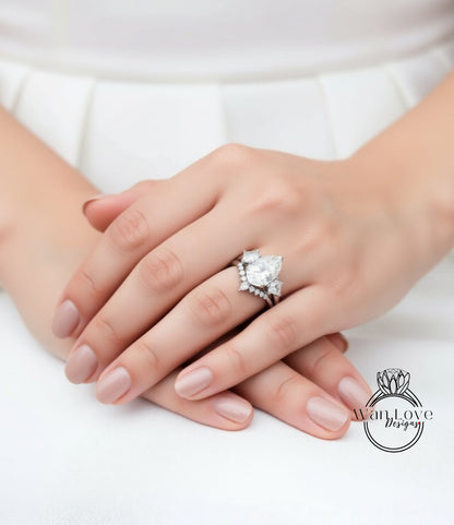 A close-up of a person's hands wearing a large diamond ring on the ring finger.