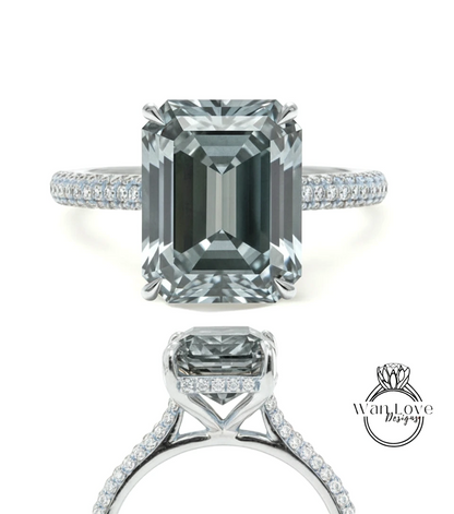 A stunning diamond engagement ring with a large, rectangular-shaped diamond set in a silver band adorned with small diamonds.