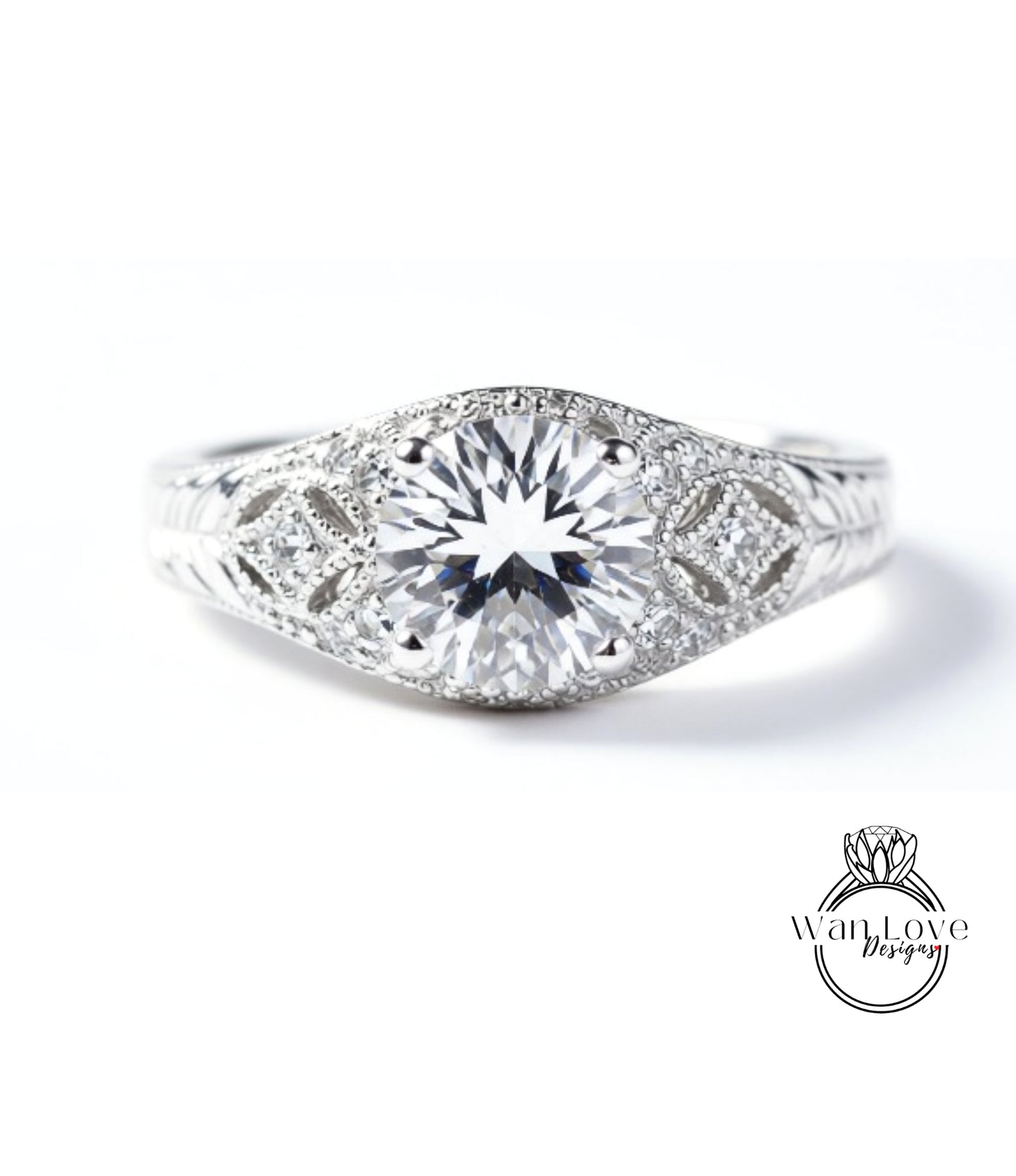 A close-up view of a diamond engagement ring with a large central diamond surrounded by smaller diamonds and intricate metalwork.