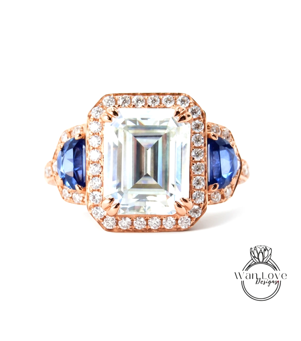 A large, clear gemstone ring with a halo of smaller diamonds around the center stone.
