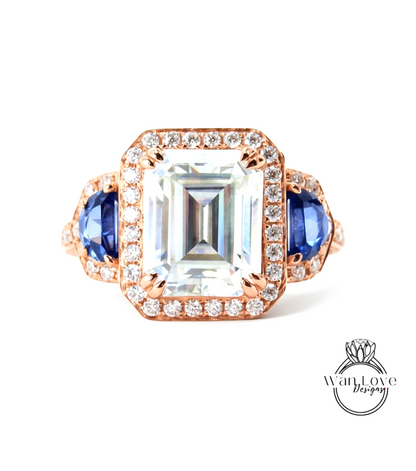 A large, clear gemstone ring with a halo of smaller diamonds around the center stone.