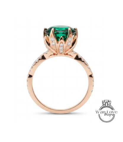 A rose gold ring with a large, green gemstone at the center, surrounded by small diamonds.