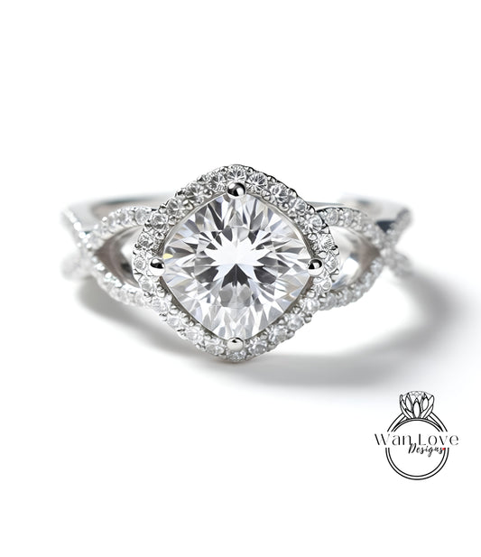 A close-up of a diamond engagement ring with a large central diamond surrounded by smaller diamonds and a halo of smaller diamonds around the center.