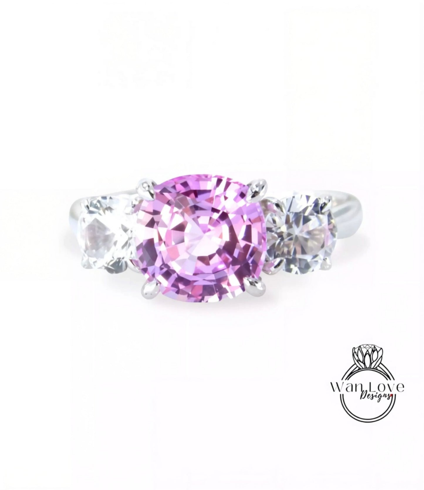 A ring with a large pink gemstone surrounded by smaller clear gemstones.